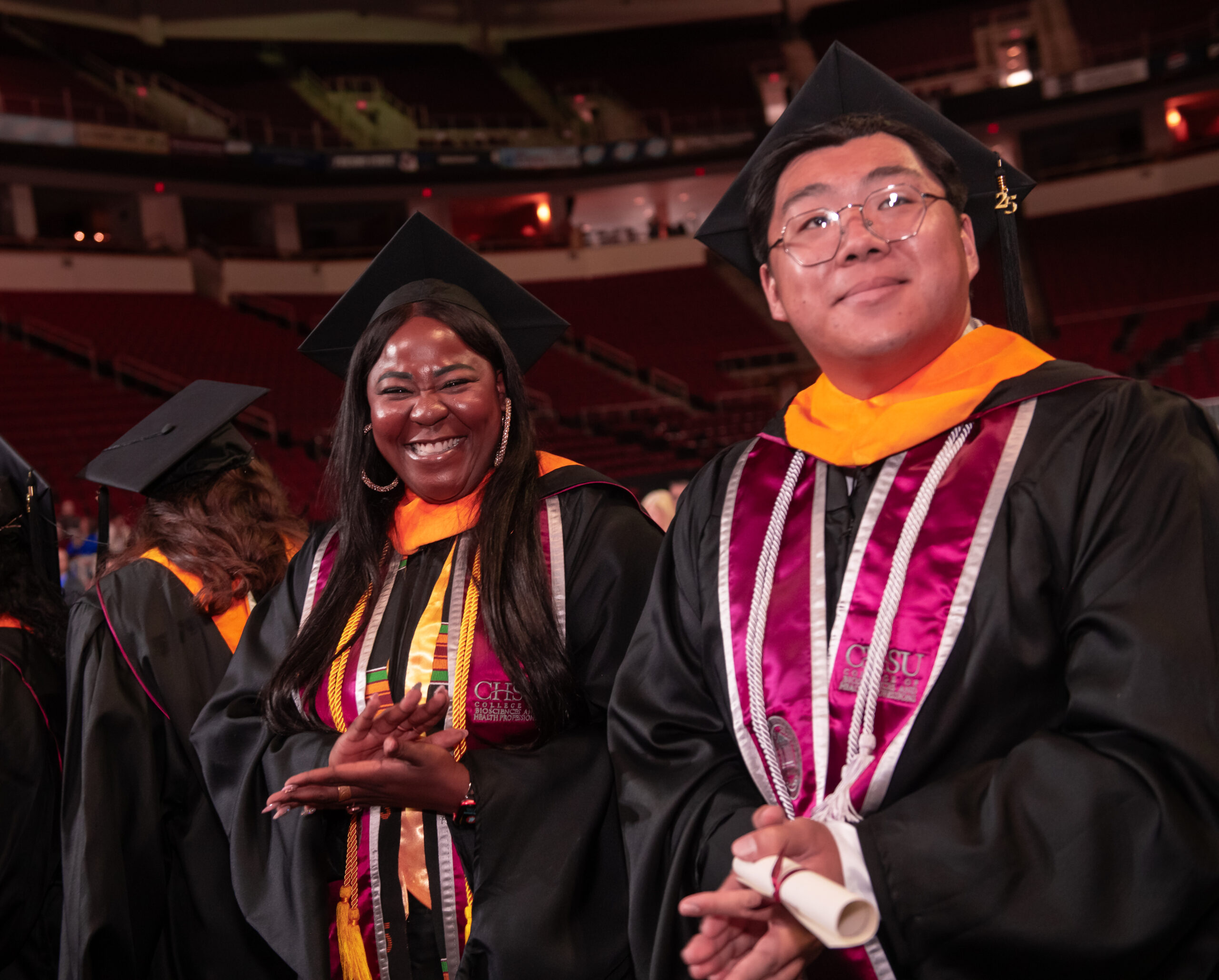 Graduates in academic regalia at Commencement
