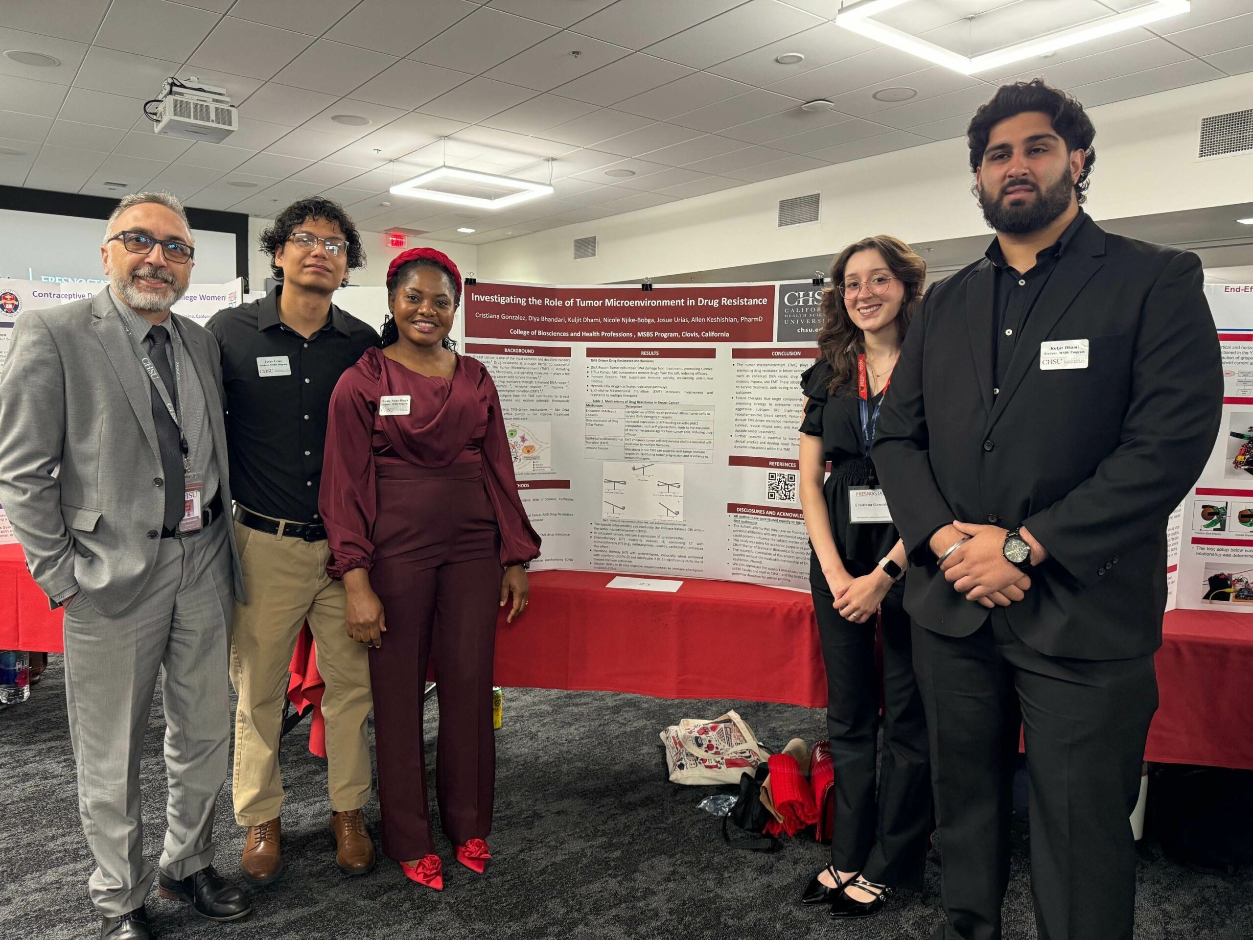 People standing in front of research poster