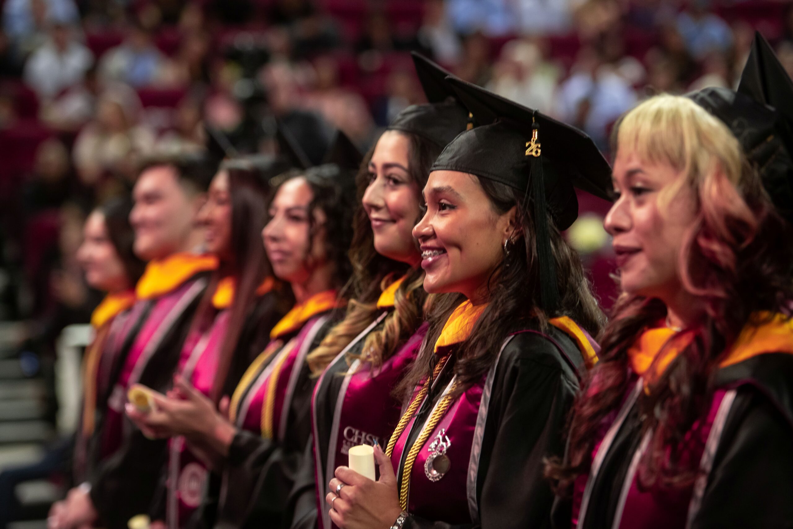 MSBS graduates wearing regalia standing at Commencement ceremony