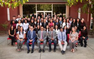 class of 2026 group with faculty in front of building